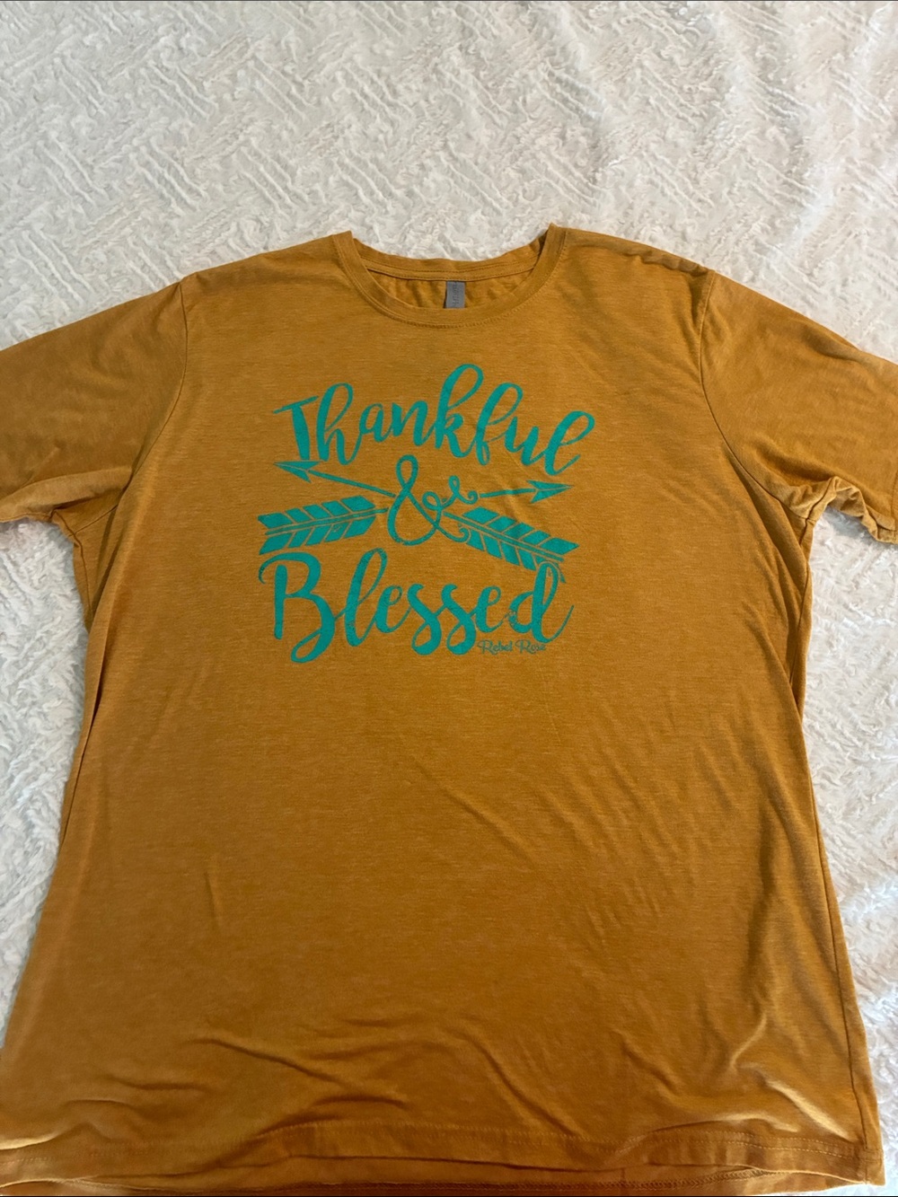 Next Level Apparel Mustard Short-Sleeve Tee with Teal Graphic